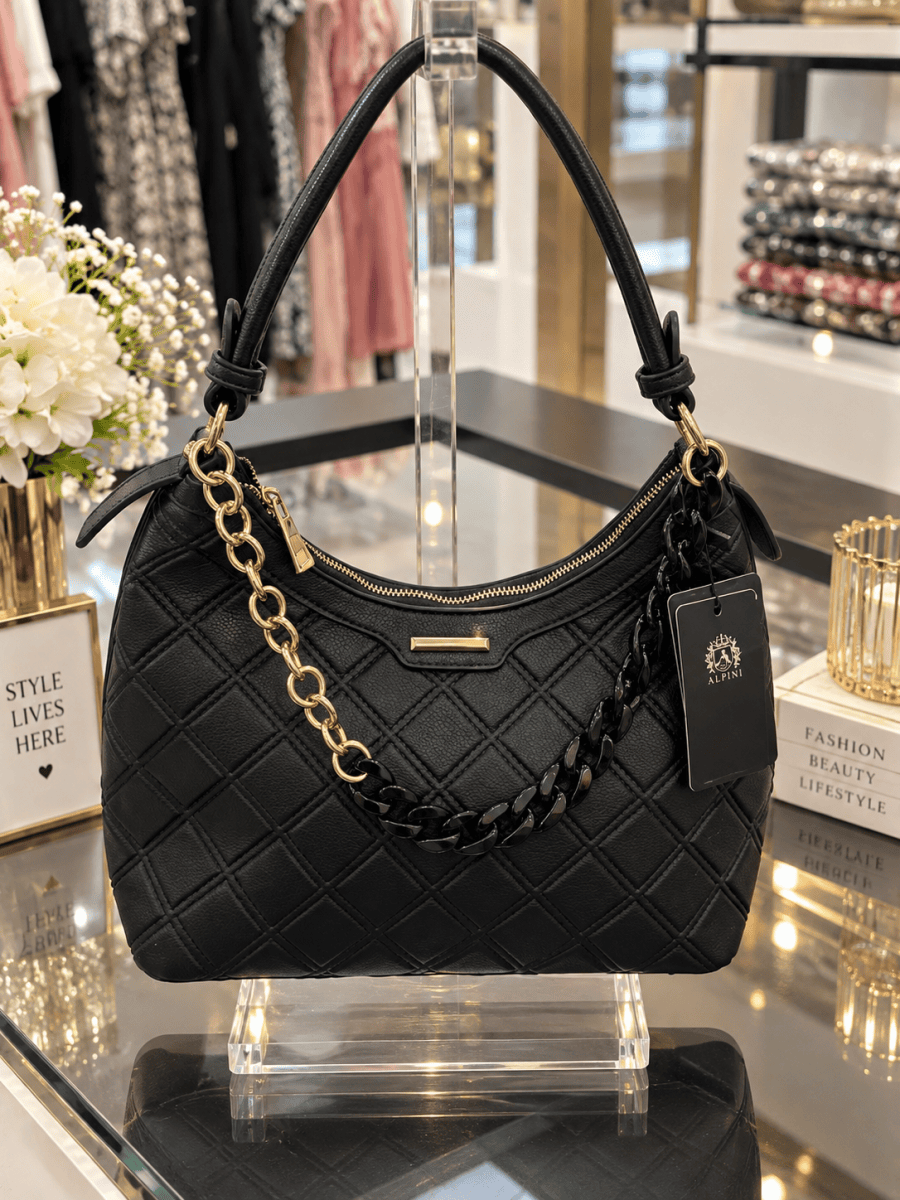(357) Elegant black faux leather hobo shoulder bag with a stylish quilted design, chic gold hardware and statement chain detailing. Spacious, versatile and perfect for everyday wear or special occasions